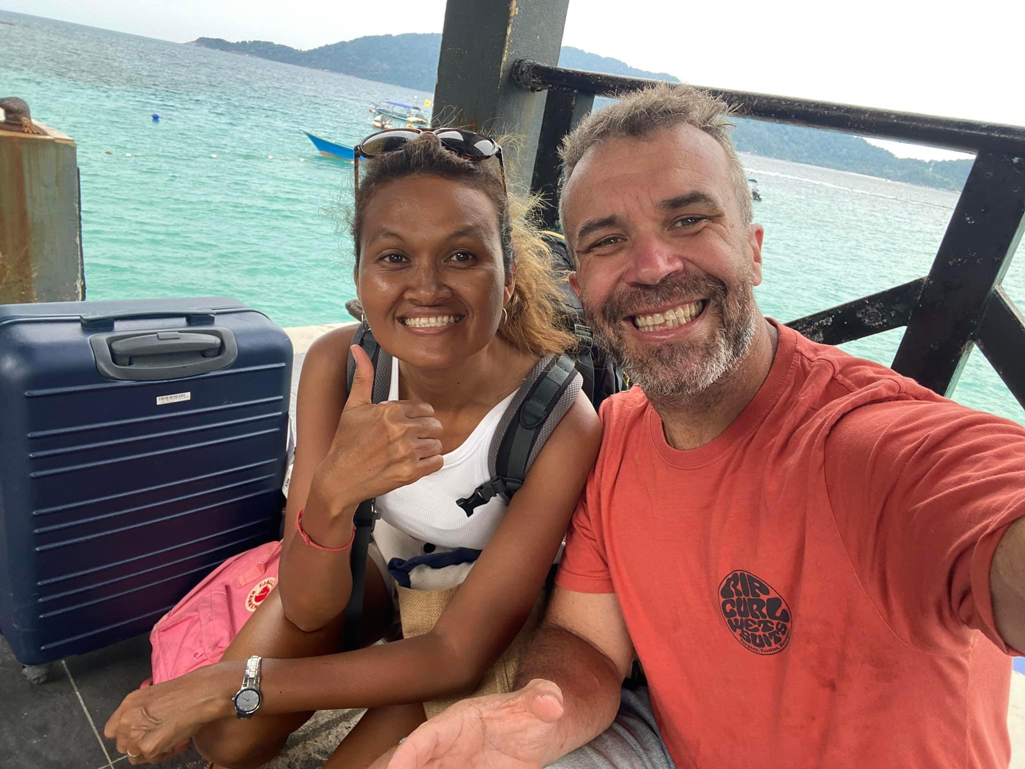 A stunning view of us enjoying the crystal-clear waters and sandy beaches of Pulau Perhentian, surrounded by lush nature and vibrant marine life.