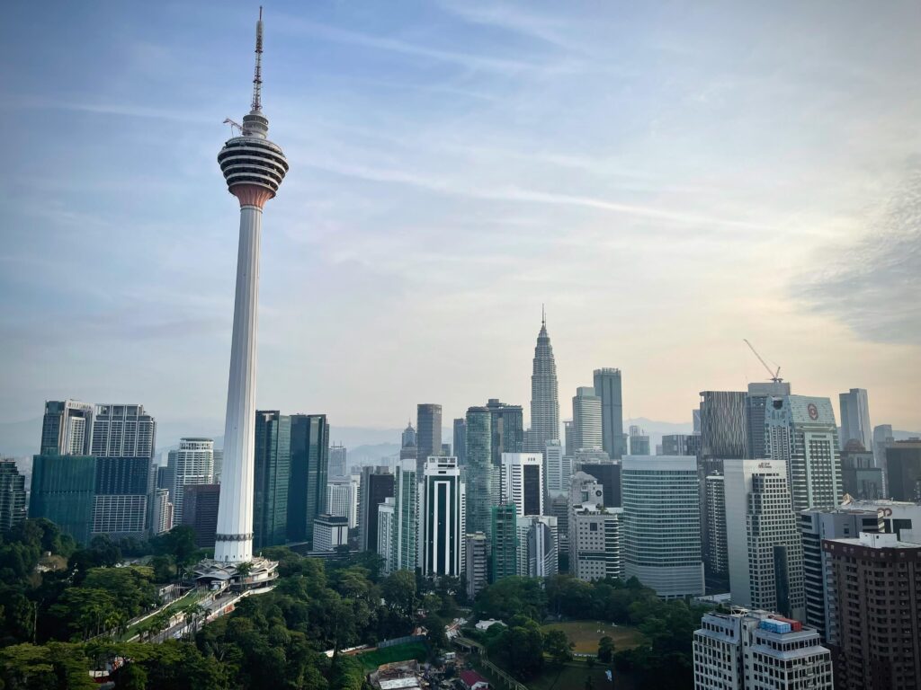 A stunning view of KL Tower in Kuala Lumpur, Malaysia, standing tall against the city skyline.