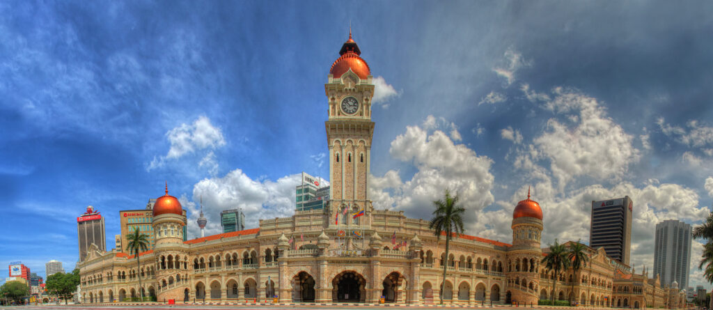 The majestic Sultan Abdul Samad Building in Kuala Lumpur, featuring stunning Moorish architecture and a towering clock tower.