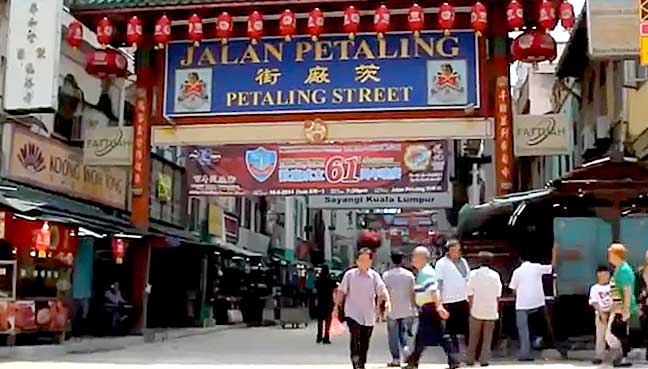 The bustling streets of Chinatown Kuala Lumpur, filled with vibrant market stalls, street food, and cultural landmarks.